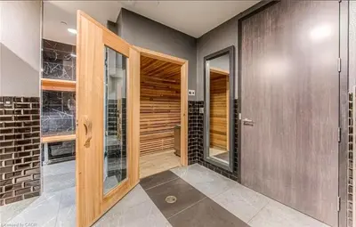 a pivot door in a home with a walk in closet at Cozy 2BD Near UW in Waterloo