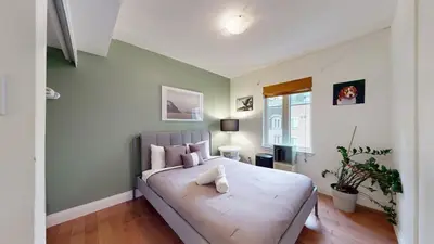 a bedroom with a large bed in a room at Liberty Village-BMO Field-Roof Patio-Parking in Toronto