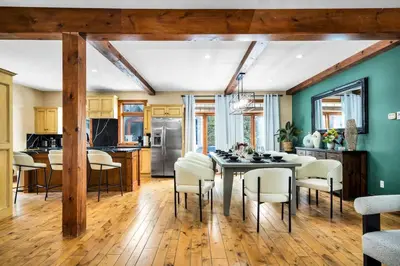 a kitchen and dining room with a table and chairs at Best Location Chalet Walk to Village-Ski in Ski out Extra Large Hottub in Blue Mountains