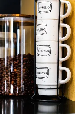 a cup of coffee and a glass jar of coffee beans at Best Location Chalet Walk to Village-Ski in Ski out Extra Large Hottub in Blue Mountains