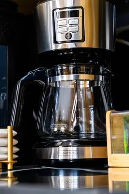 a coffee pot sitting on top of a microwave at Best Location Chalet Walk to Village-Ski in Ski out Extra Large Hottub in Blue Mountains