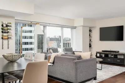 a living room with a couch and a table at Centrally located 2 Bd 2 Bth + Parking in Toronto