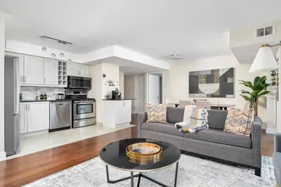 a living room with a couch and a table at Centrally located 2 Bd 2 Bth + Parking in Toronto