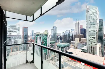 a view of a city skyline from a balcony at Apartament Downtown Toronto + Beautiful View in Toronto