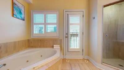 a large bathroom with a tub and a shower at Modern & Spacious Midtown Toronto Family Home in Toronto
