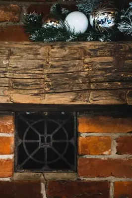 a fireplace with christmas decorations on top of it at Cozy upgraded Chalet Hot Tubs Sauna Fireplace in Blue Mountains
