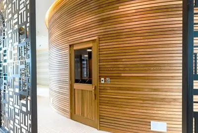 a wooden wall with a door in a building at Toronto Lakeview by TMU & UofT with Pool, Gym & Parking in Toronto