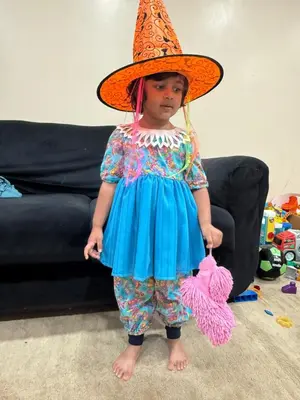 a little girl wearing a blue dress and a hat at Luxury room at southern Guelph in Guelph