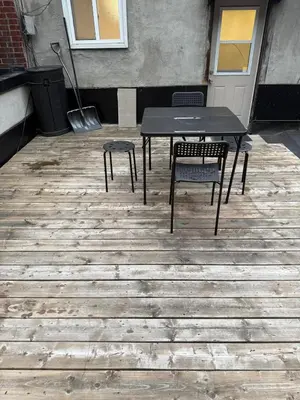 a black table and two chairs on a patio at DOWNTOWN-BMO Field Stay-Next to Transit-Restaurants-Union Station in Toronto