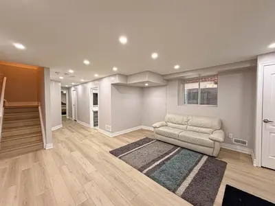 a living room with a couch and a rug at Blessed Home in Milton