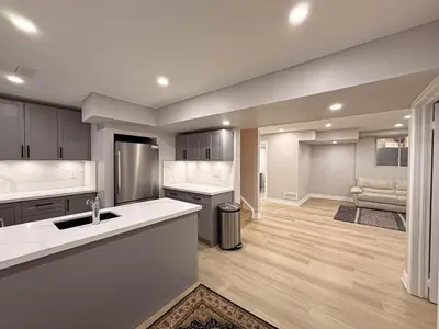 a large kitchen with a sink and a counter at Blessed Home in Milton