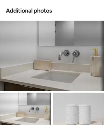 a white sink with two faucets on a counter at Basek Apartments in Toronto
