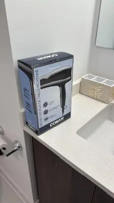 a box sitting on top of a counter next to a sink at Basek Apartments in Toronto