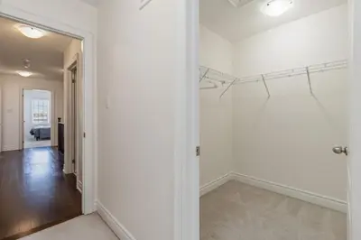 an empty room with white walls and a hallway at Serenity Home in Brampton in Brampton