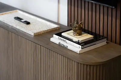 a shelf with books and a statue of a dog on them at Lux Harbourfront Home Sleeps 10 with Free Parking in Toronto