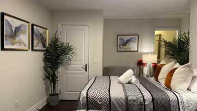 a bedroom with a bed and two potted plants at Executive Luxury Stay Corporate Paradise in South Richvale in Richmond Hill