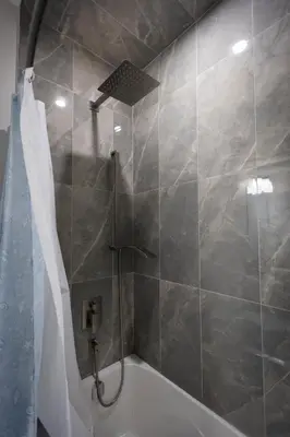 a bathroom with a shower and a bath tub at Cozy Cove Retreat, Private Suite Near Friday Harbour, Barrie & Lake Simcoe in Innisfil