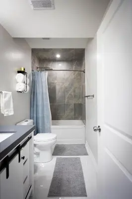 a white bathroom with a toilet and a shower at Cozy Cove Retreat, Private Suite Near Friday Harbour, Barrie & Lake Simcoe in Innisfil
