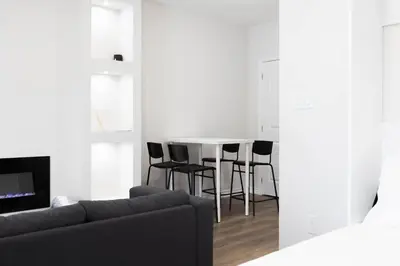 a living room with a table and chairs at Cozy Cove Retreat, Private Suite Near Friday Harbour, Barrie & Lake Simcoe in Innisfil