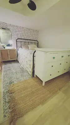 a bedroom with a white bed and a dresser and a dresser at Grimsby on the Lake sweet, your perfect retreat in Grimsby
