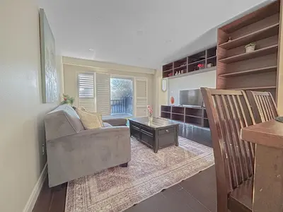 a living room with a couch and a table at Executive Urban Retreat in Brampton