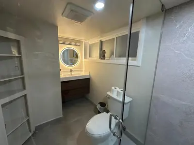 a bathroom with a toilet and a sink and a shower at Modern 2 bedrooms 1 bath updated unit Near Downtown Kitchener & Airport in Kitchener