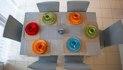 a lego table with different colored plates on it at Karibu Home Retreat, 5 min to Ontario Largest Spa in Ajax