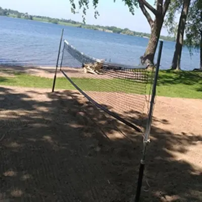 a hammock on the shore of a lake at Prime Waterfront Cottage on Sandbanks Area Resort in Cherry Valley