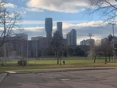 a city skyline with tall buildings in a park at Parkside Modern Retreat in Mississauga