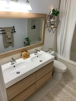 a bathroom with a white sink and a toilet at Parkside Modern Retreat in Mississauga