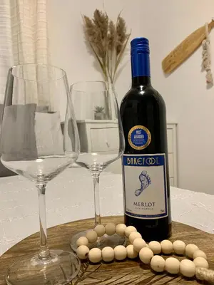 a bottle of wine and two glasses on a table at Parkside Modern Retreat in Mississauga