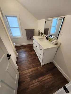 a bathroom with a sink and a mirror at Getaway by the bay in Owen Sound