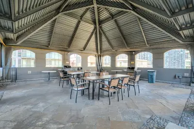 a large room with tables and chairs in a building at Downtown 1BR Condo w/ Balcony & Gym Access in Toronto