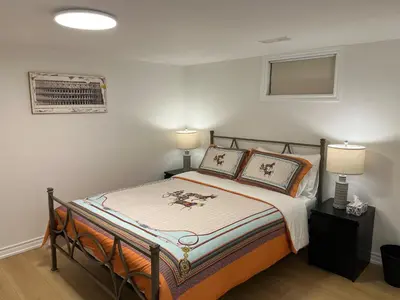 a bedroom with a bed with two pillows on it at Cozy Private Room with Shared Bathroom in Toronto in Toronto