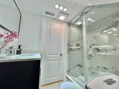 a bathroom with a shower and a toilet at Cozy Private Room with Shared Bathroom in Toronto in Toronto