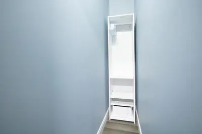 an empty closet with a mirror in a room at Designer 2BR Suite - Steps to Vic Hospital - Wortley in London