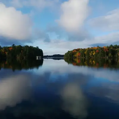 a large lake with a boat in the middle at Olga's Bay Lakehouse in Minett