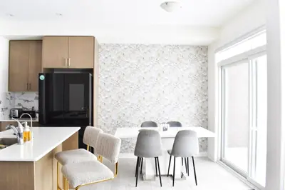 a kitchen with a table and chairs in a kitchen at Spacious 4BR Home with EV Charger in Cambridge