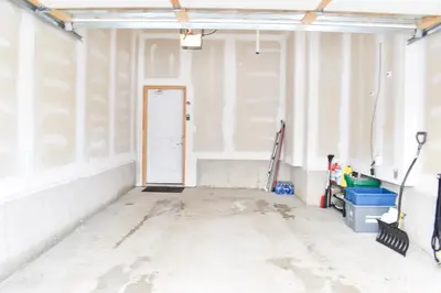 an empty room with a door in a building at Spacious 4BR Home with EV Charger in Cambridge