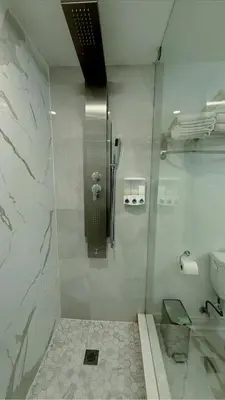 a bathroom with a shower and a toilet at Studio 8848 - Sleeps 8 in Brampton