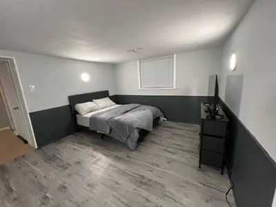 a bedroom with a bed and a television in it at Prime Location Studio with Separate amenities in London