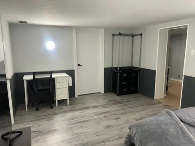 an empty bedroom with a desk and a bed at Prime Location Studio with Separate amenities in London