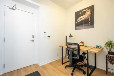 an office with a desk and a chair at Stunning Lake and CN Tower View with 2BR 2BA Free Parking in Toronto