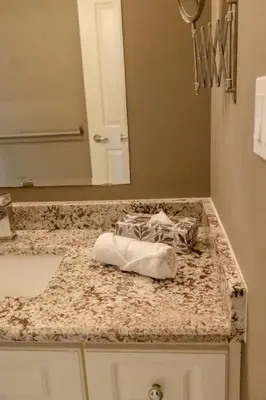 a bathroom counter with a sink and a mirror at The Bards Roost - 3BR King Ensuite Family Friendly in Stratford