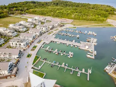 an aerial view of a marina with boats in the water at Lovely Open Concept Friday Harbor Resort Condo in Innisfil
