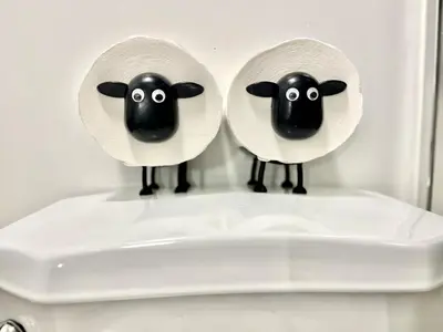 two sheep on the top of a toilet seat at The Scholar Suite Modern Comfort Near Western U in London
