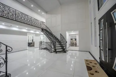 a hallway with a spiral staircase in a house at Perfect Group Getaway Large House with Style in Bolton