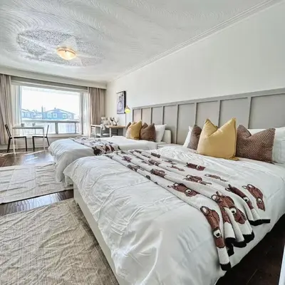 a large bedroom with two large beds in it at Cozy Studio with 2 Beds & Private Bathroom in Toronto