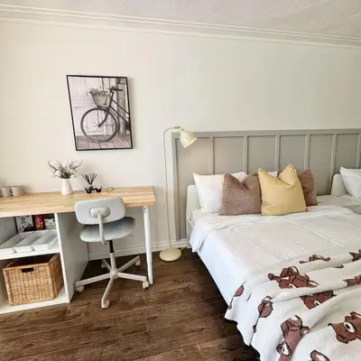 a bedroom with two beds and a desk and a desk at Cozy Studio with 2 Beds & Private Bathroom in Toronto