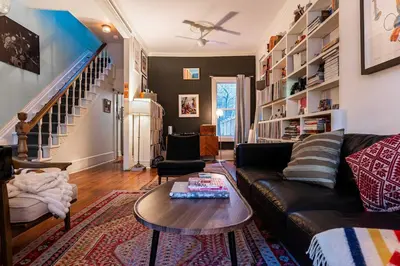 a living room with a couch and a table at Spacious 3 Bedroom Toronto Home with Piano in Toronto